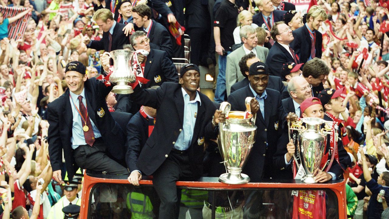 Manchester United celebrate winning the treble during an open top bus parade through Manchester.