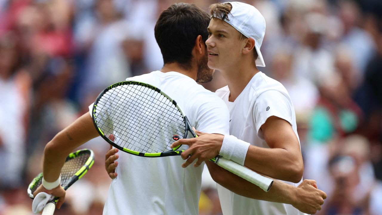 Tennis - Wimbledon - All England Lawn Tennis and Croquet Club, London, Britain - July 12, 2023
Spain's Carlos Alcaraz and Denmark's Holger Rune embrace after their quarter final match REUTERS/Hannah Mckay