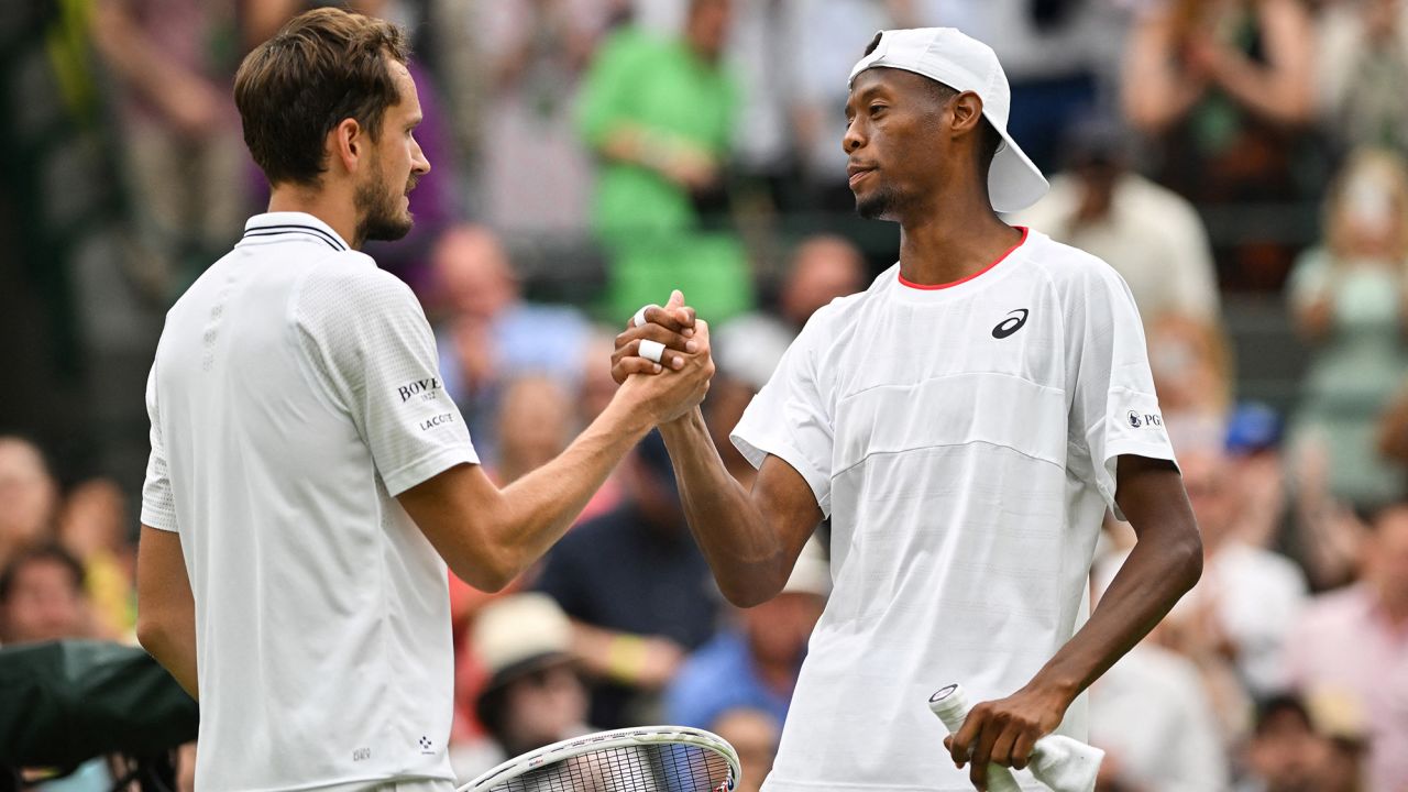 Russia's Daniil Medvedev (L) shakes hands after winning against US player Christopher Eubanks during their men's singles quarter-finals tennis match on the tenth day of the 2023 Wimbledon Championships at The All England Lawn Tennis Club in Wimbledon, southwest London, on July 12, 2023. (Photo by Glyn KIRK / AFP) / RESTRICTED TO EDITORIAL USE (Photo by GLYN KIRK/AFP via Getty Images)