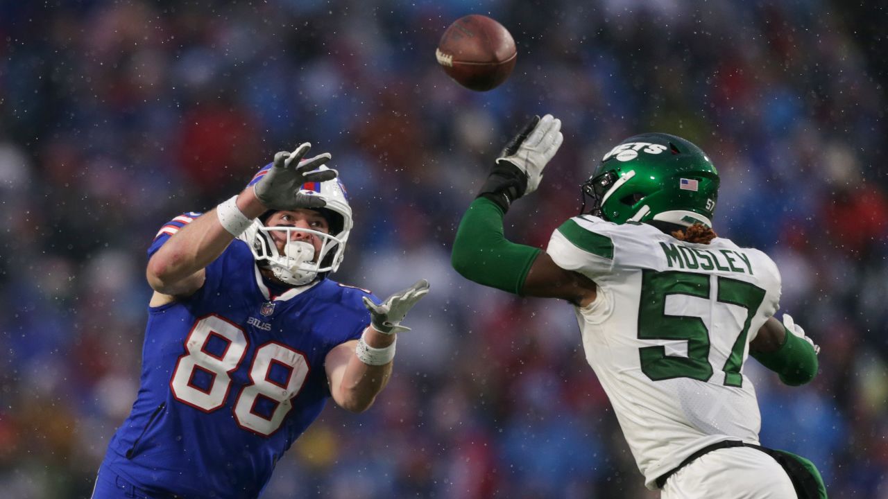 ORCHARD PARK, NEW YORK - DECEMBER 11: Dawson Knox #88 of the Buffalo Bills looks to make a catch as C.J. Mosley #57 of the New York Jets defends in the fourth quarter at Highmark Stadium on December 11, 2022 in Orchard Park, New York. (Photo by Joshua Bessex/Getty Images)