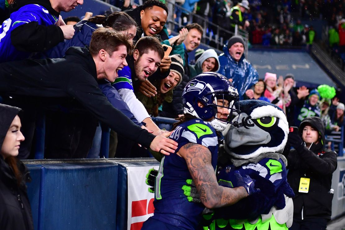 SEATTLE, WASHINGTON - DECEMBER 18: Jaxon Smith-Njigba #11 of the Seattle Seahawks celebrates after a touchdown reception in the fourth quarter at Lumen Field on December 18, 2023 in Seattle, Washington. (Photo by Jane Gershovich/Getty Images)