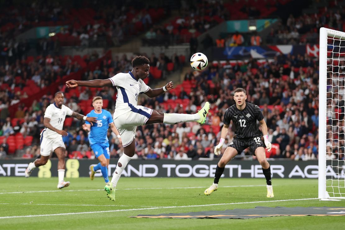 Bukayo Saka of England attempts to keep the ball in play during the international friendly match between England and Iceland at Wembley Stadium on June 07, 2024 in London, England.