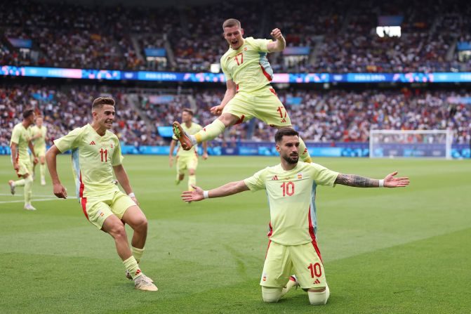 Spain's Álex Baena (No. 10) celebrates after scoring a goal to put his team up 3-1 in the soccer final against France on August 9. France fought back to tie the match and force extra time, but <a href=