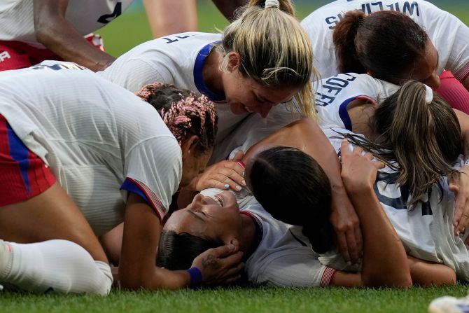 US soccer player Sophia Smith is mobbed by teammates after scoring an extra-time goal against Germany on Tuesday, August 6. The Americans won 1-0 <a href=