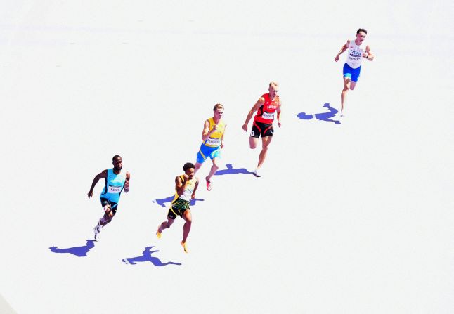 Athletes compete in a 200-meter repechage race on August 6.