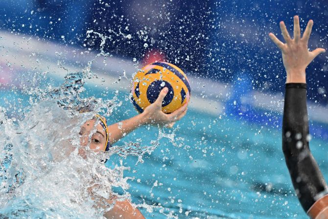 Spain's Elena Ruiz shoots the ball during a water polo match against Canada on August 6. Spain won 18-8 to advance to the semifinals.