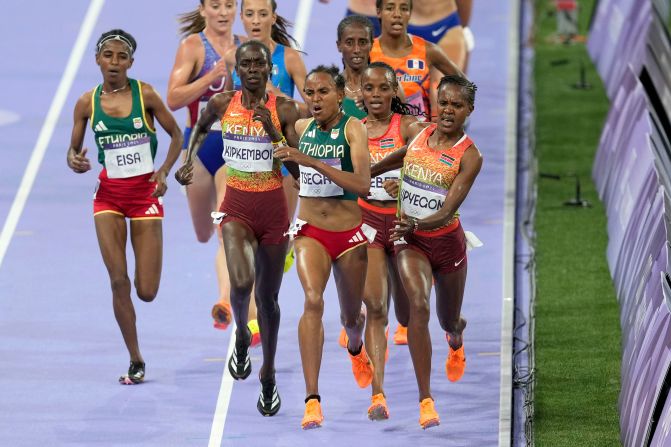 Kenya's Faith Kipyegon, right, fights for the lead during the 5,000-meter final on August 5. Kipyegon was initially disqualified, <a href=