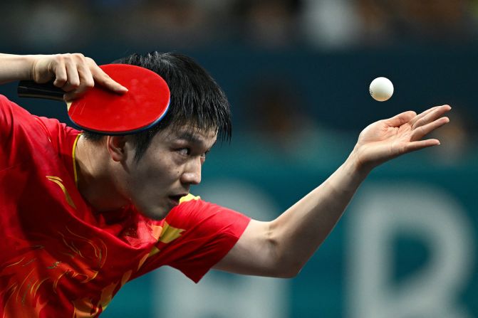 Chinese table tennis player Fan Zhendong serves to Sweden’s Truls Möregårdh during the final of men's singles on August 4. <a href=