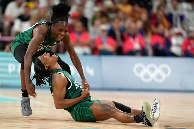 Nigerian basketball players Promise Amukamara, left, and Ezinne Kalu celebrate during their game against Canada on August 4. With a 79-70 win, <a href=