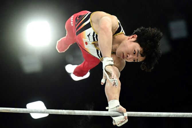 Japanese gymnast Shinnosuke Oka competes on the horizontal bar during the individual all-around on July 31. <a href=