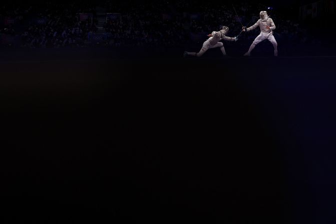 Hungarian fencer Krisztian Rabb, left, faces South Korea's Park Sang-won on July 31. South Korea won gold in the team sabre event.