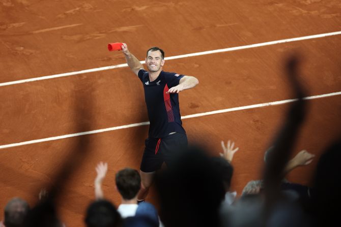 British tennis player Andy Murray throws his sweatband into the crowd after he and doubles partner Dan Evans <a href=