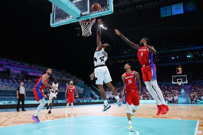 South Sudanese basketball player Carlik Jones drives to the basket during a game against Puerto Rico on July 28. South Sudan claimed a <a href=