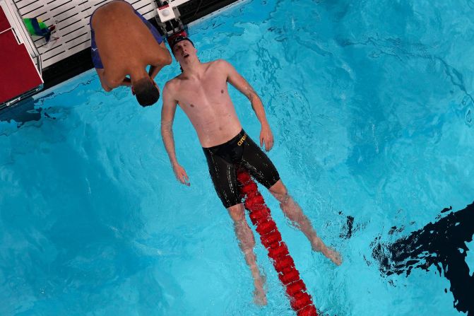 Germany's Lukas Maertens falls back on a lane rope after <a href=