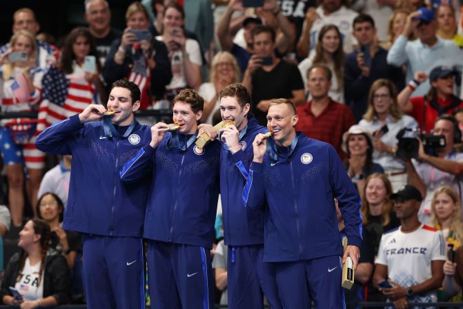 Swimmers Jack Alexy, Chris Guiliano, Hunter Armstrong and Caeleb Dressel celebrate on July 27 after winning the men's 4x100-meter freestyle relay and claiming <a href=