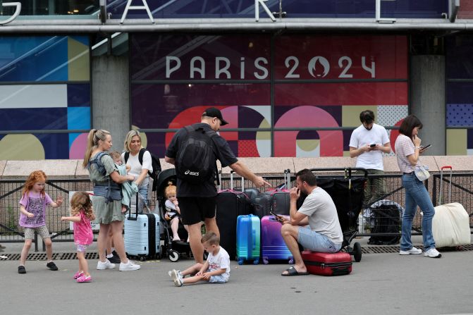 Travellers from Sydney wait outside the Gare Montparnasse train station on July 26. Just hours before the opening ceremony, <a href=