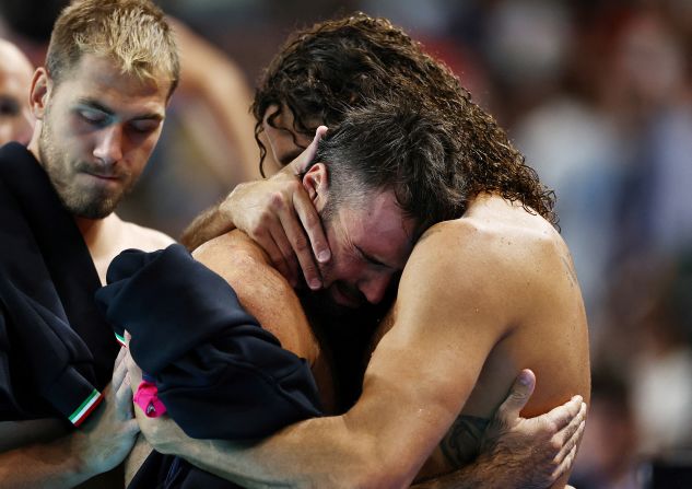 Italian water polo player Andrea Fondelli is consoled after a quarterfinal loss to Hungary on August 7.