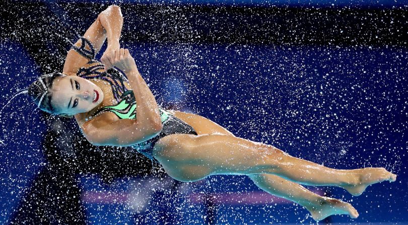 A member of Team USA performs during the artistic swimming competition on August 7.