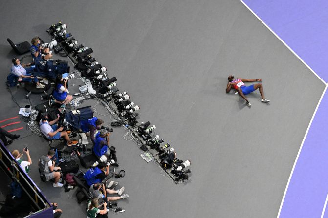 US sprinter Noah Lyles lies on the ground after the 200 meters. Lyles, who was diagnosed with Covid-19 earlier this week, <a href=