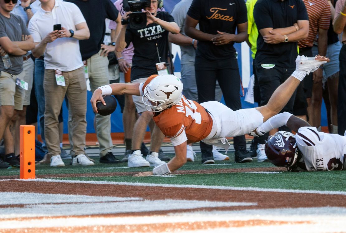 Texas quarterback Arch Manning dives toward the goalline during the second half.