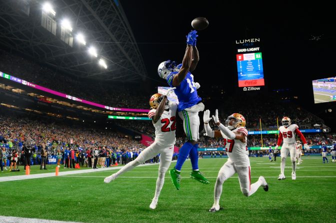 San Francisco 49ers cornerback Isaac Yiadom and safety Ji'Ayir Brown break up a touchdown pass intended for Seattle Seahawks wide receiver DK Metcalf in Seattle on Thursday, October 10.