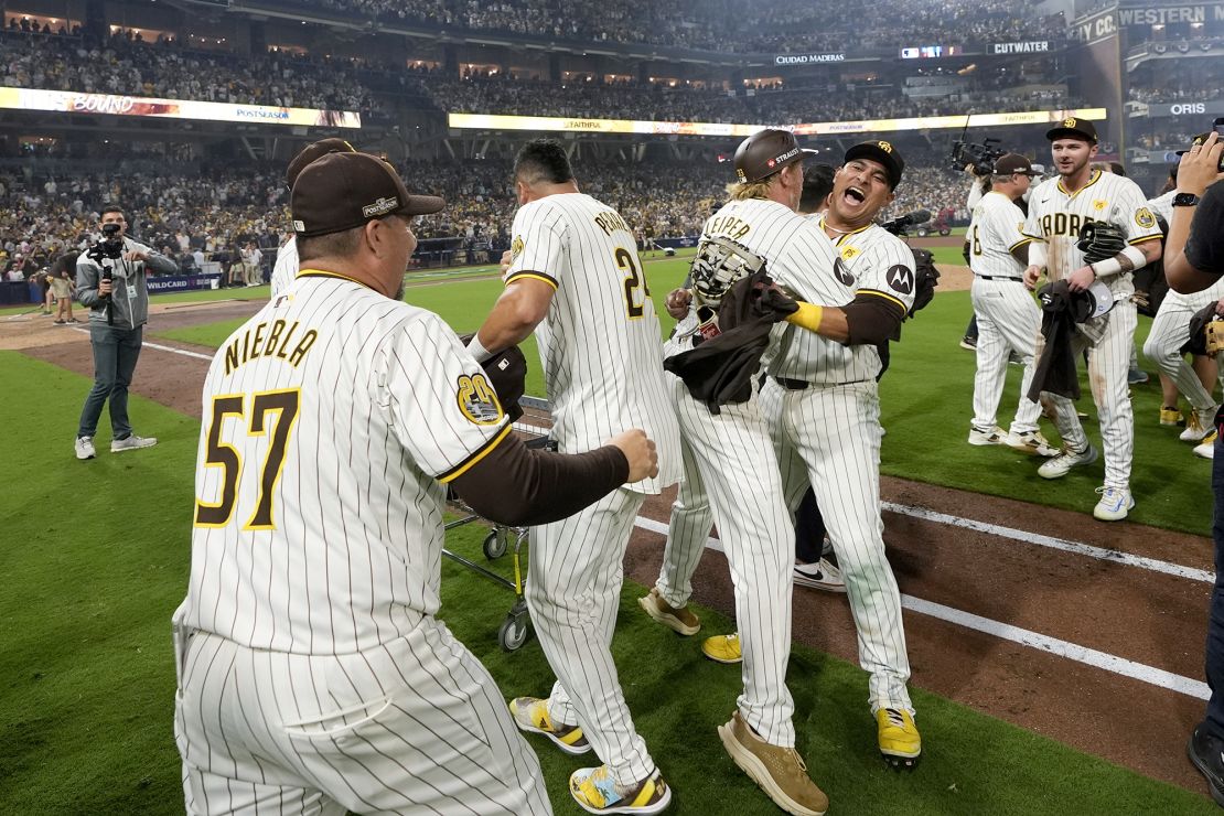 The San Diego Padres celebrate after the win over the Atlanta Braves.