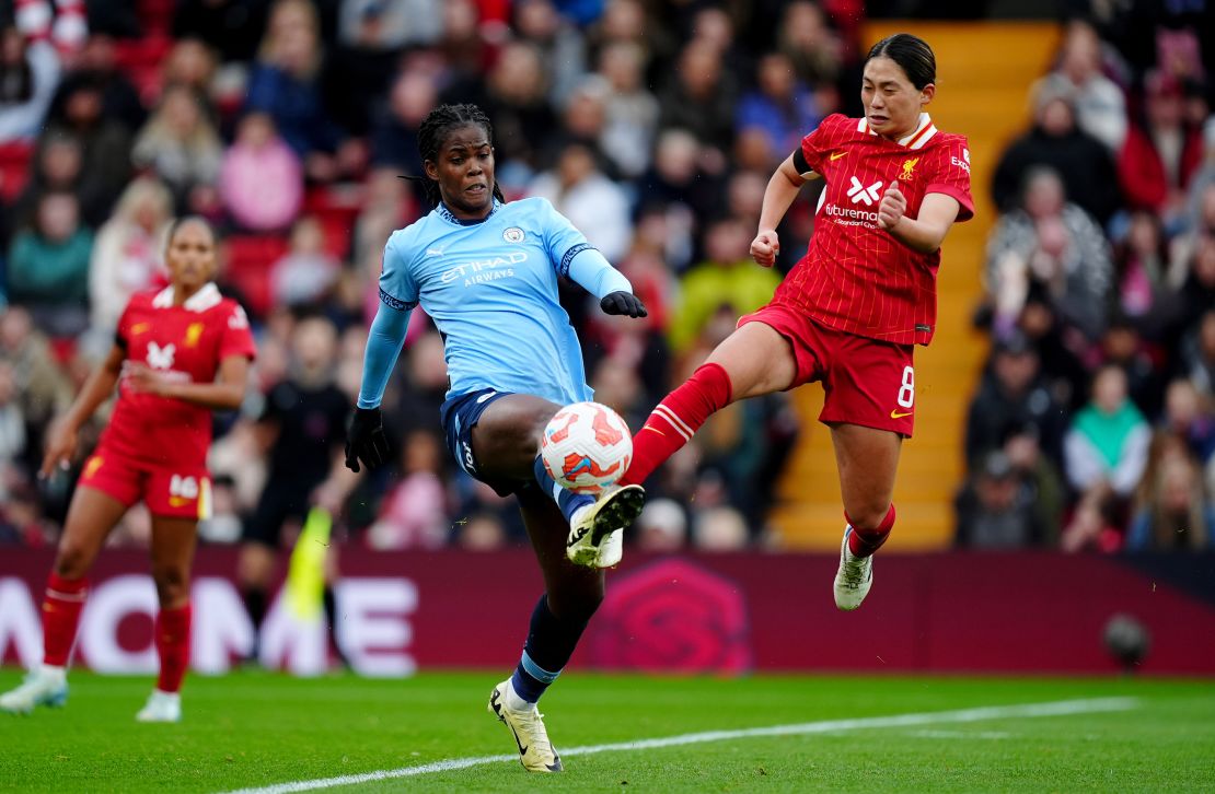 Manchester City's Khadija Shaw (left) and Liverpool's Fuka Nagano battle for the ball during the Barclays Women's Super League match at Anfield, Liverpool. Picture date: Sunday October 13, 2024. PA Photo. See PA story SOCCER Liverpool Women. Photo credit should read: Mike Egerton/PA Wire. (Photo by Mike Egerton/PA Images via Getty Images)