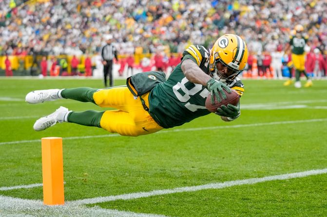 Green Bay Packers wide receiver Romeo Doubs dives for a touchdown in Green Bay, Wisconsin, on October 13. The Packers beat the Arizona Cardinals 34-13.