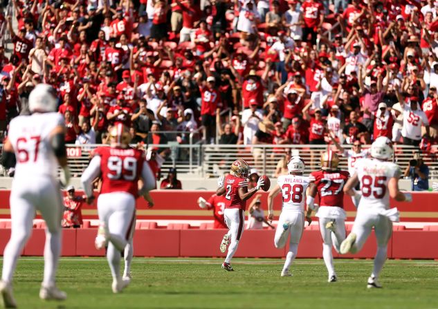 San Francisco 49ers cornerback Deommodore Lenoir runs for a touchdown after a blocked field goal during a game against the Arizona Cardinals in Santa Clara, California, on October 6. The Cardinals came back to narrowly upset the 49ers 24-23.