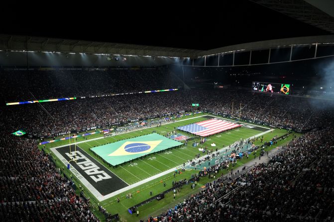 Brazilian and American flags are presented on the field at Neo Química Arena – also known as Corinthians Arena – in São Paulo ahead of the game between the Green Bay Packers and Philadelphia Eagles on Friday, September 6. <a href=