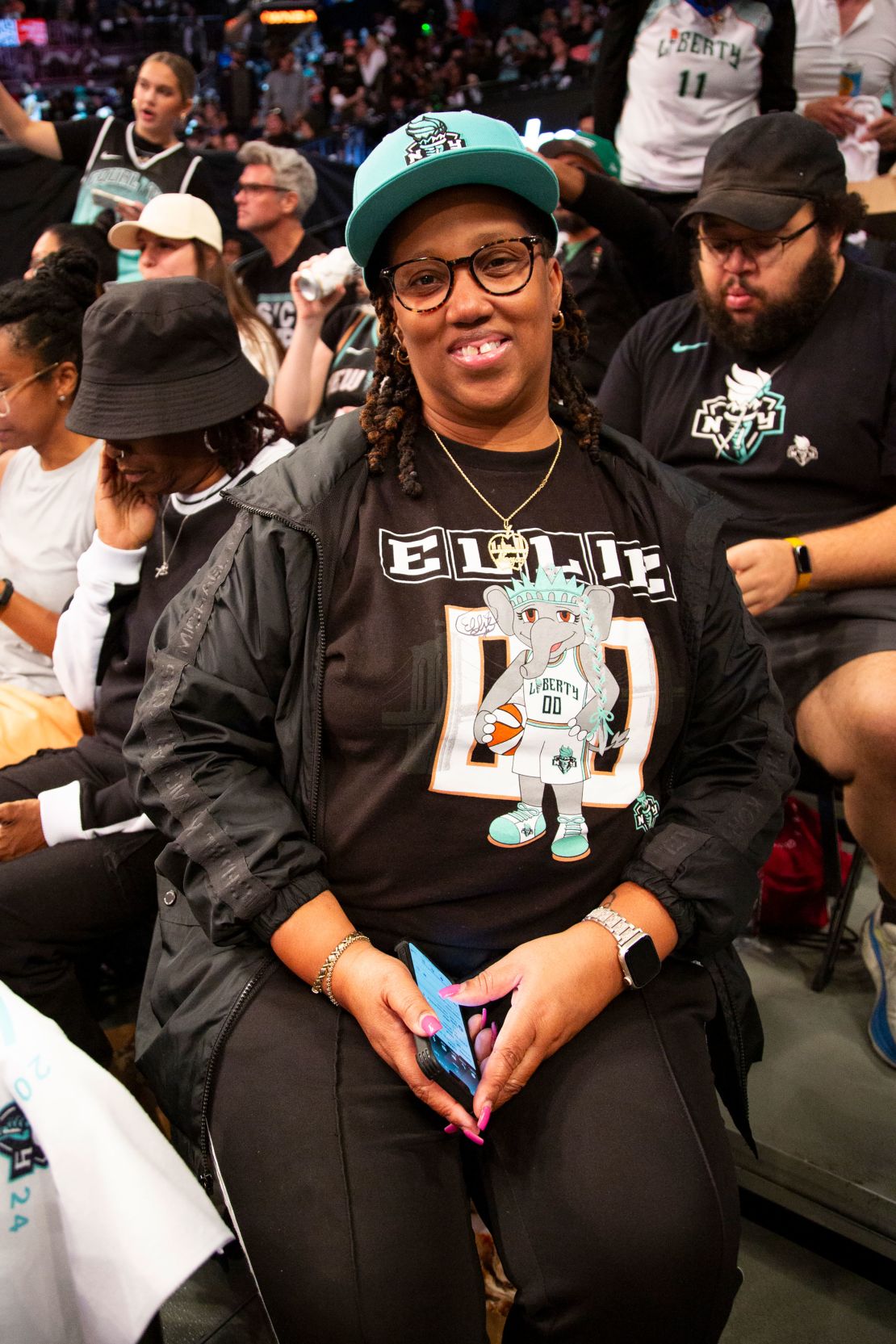 Neysa Lewis, who became a Liberty season ticket holder this year, sports an Ellie T-shirt for the big game.