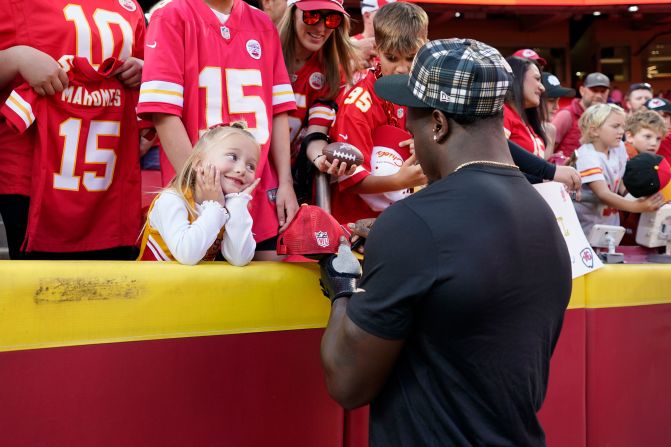 New Orleans Saints linebacker Willie Gay Jr. signs autographs for a young Kansas City Chiefs fan before the start of the game between the teams in Kansas City, Missouri, on Monday, October 7. Gay played for the Chiefs for four seasons before signing with the Saints during the offseason. <a href=