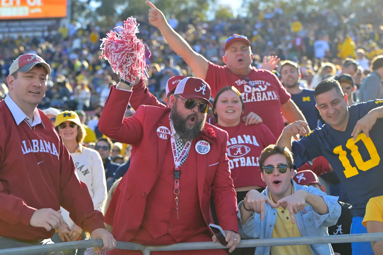 Fans cheer in the stands before the game between the Michigan Wolverines and the Alabama Crimson Tide in the 2024 Rose Bowl college football playoff semifinal game at Rose Bowl.